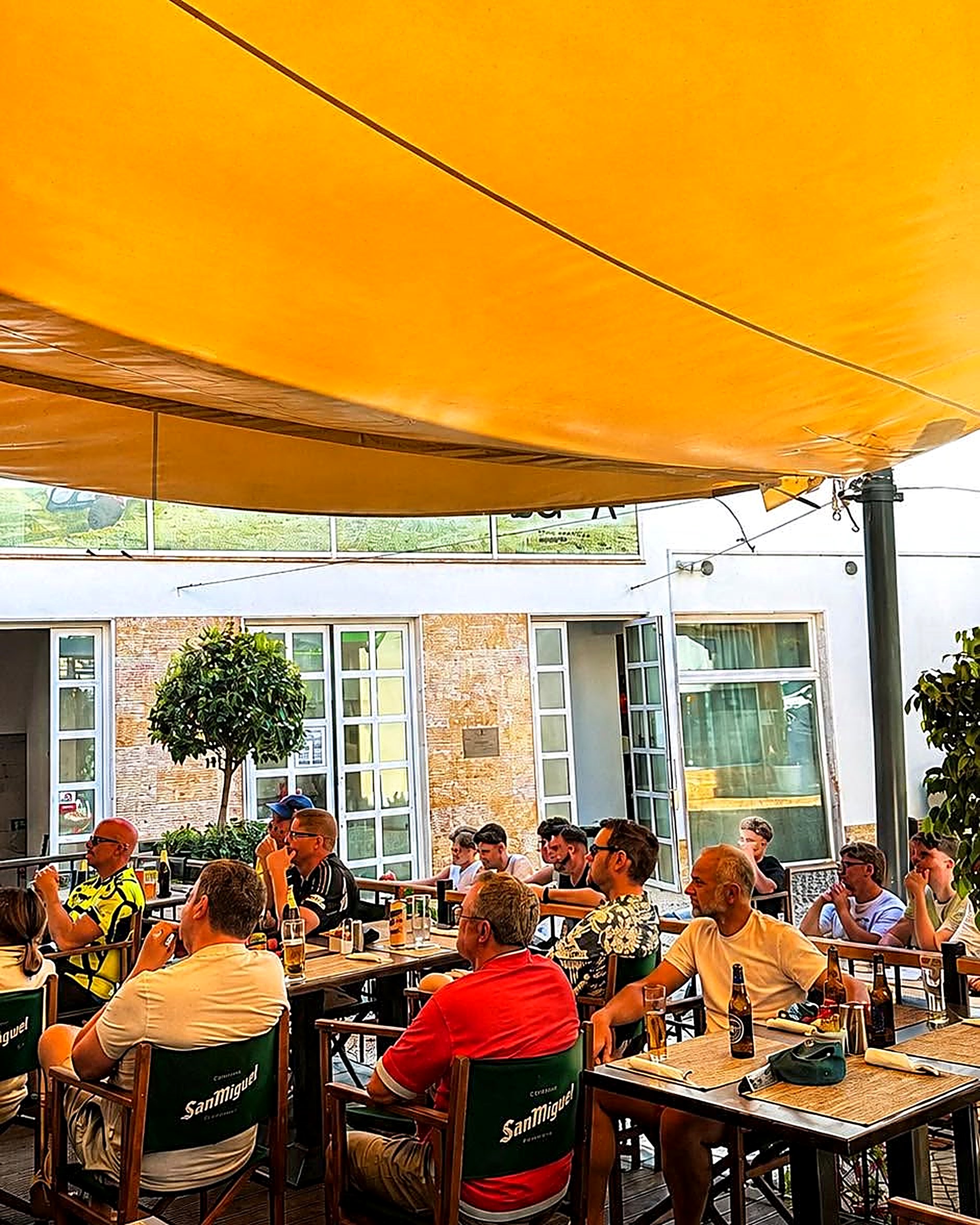 Sunny terrace under the orange awnings